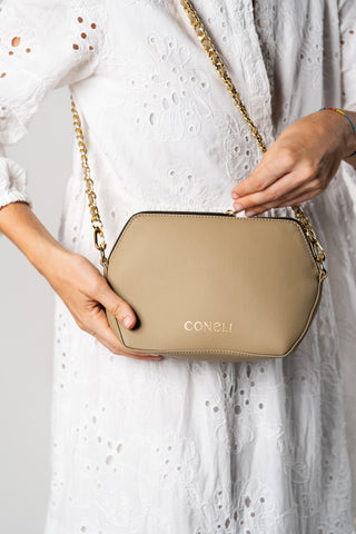 Model with Coneli Fanny Pack beige with golden chain