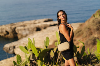 Model in Cactus field with Coneli Fanny Pack beige as shoulder bag