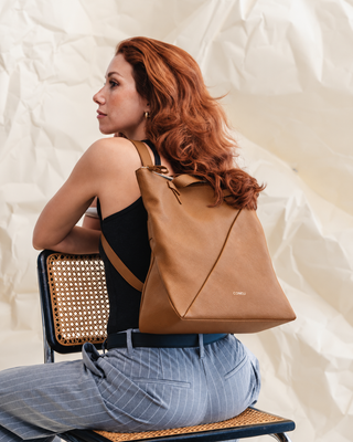 Yes, the New Coneli Tote Fits a 14-Inch Laptop