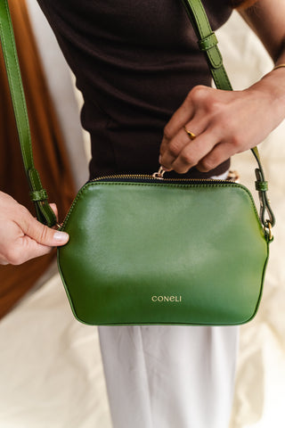 Coneli plant-based leather bag being cared for, illustrating maintenance tips for cactus, olive, and corn leather